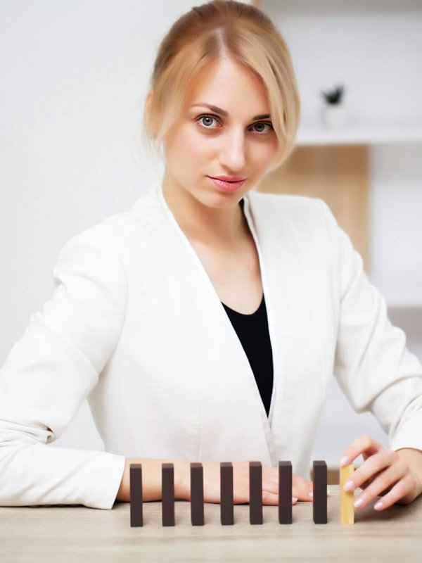 Business concept, woman builds a company development strategy from wooden cube