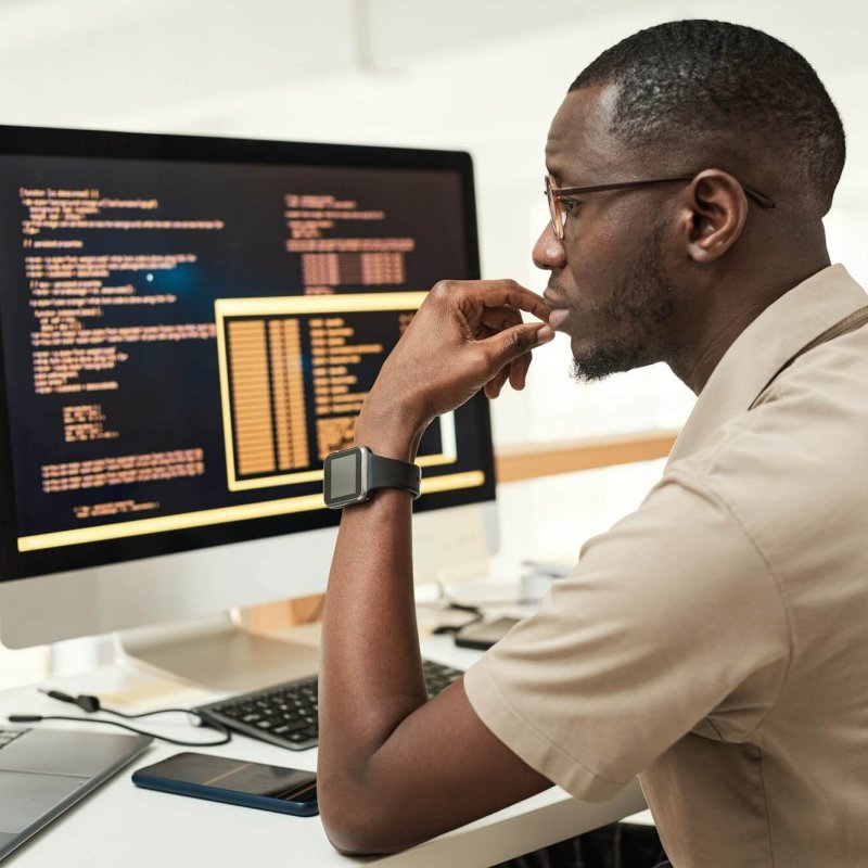 Software Engineer Reading Programming Code