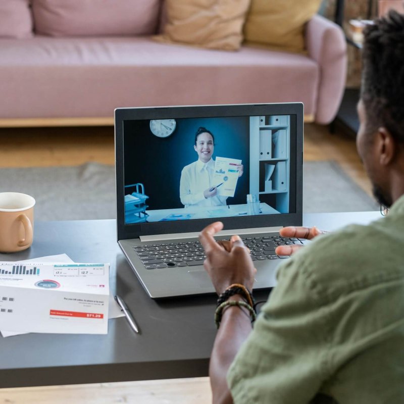 African American Man Talking To Financial Consultant