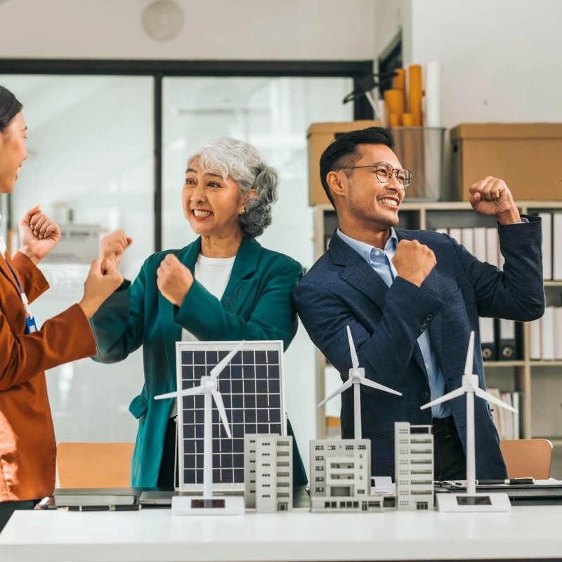 Group asian business people meeting boardroom clean energy city solutions discussing solar panels