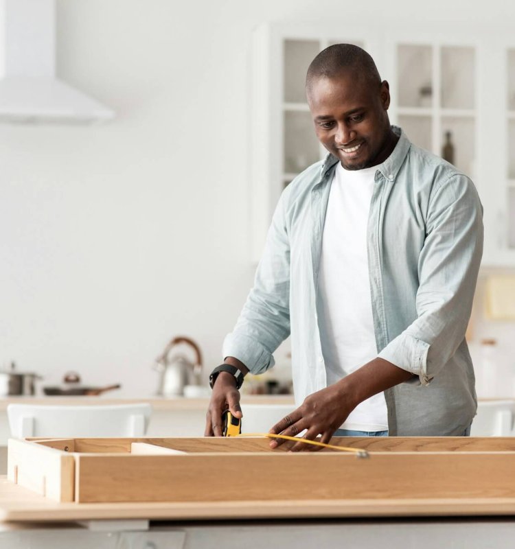 Handyman working at home, repairing, assembling and renovation or new hobby. Man measuring new table