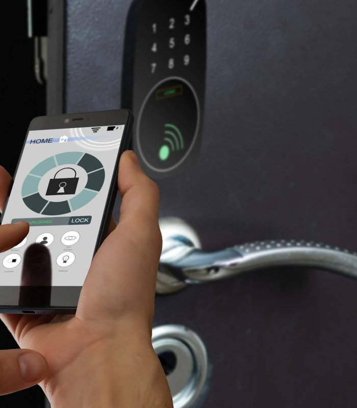 smart house, home automation, device with app icons. Man uses his smartphone with smarthome security